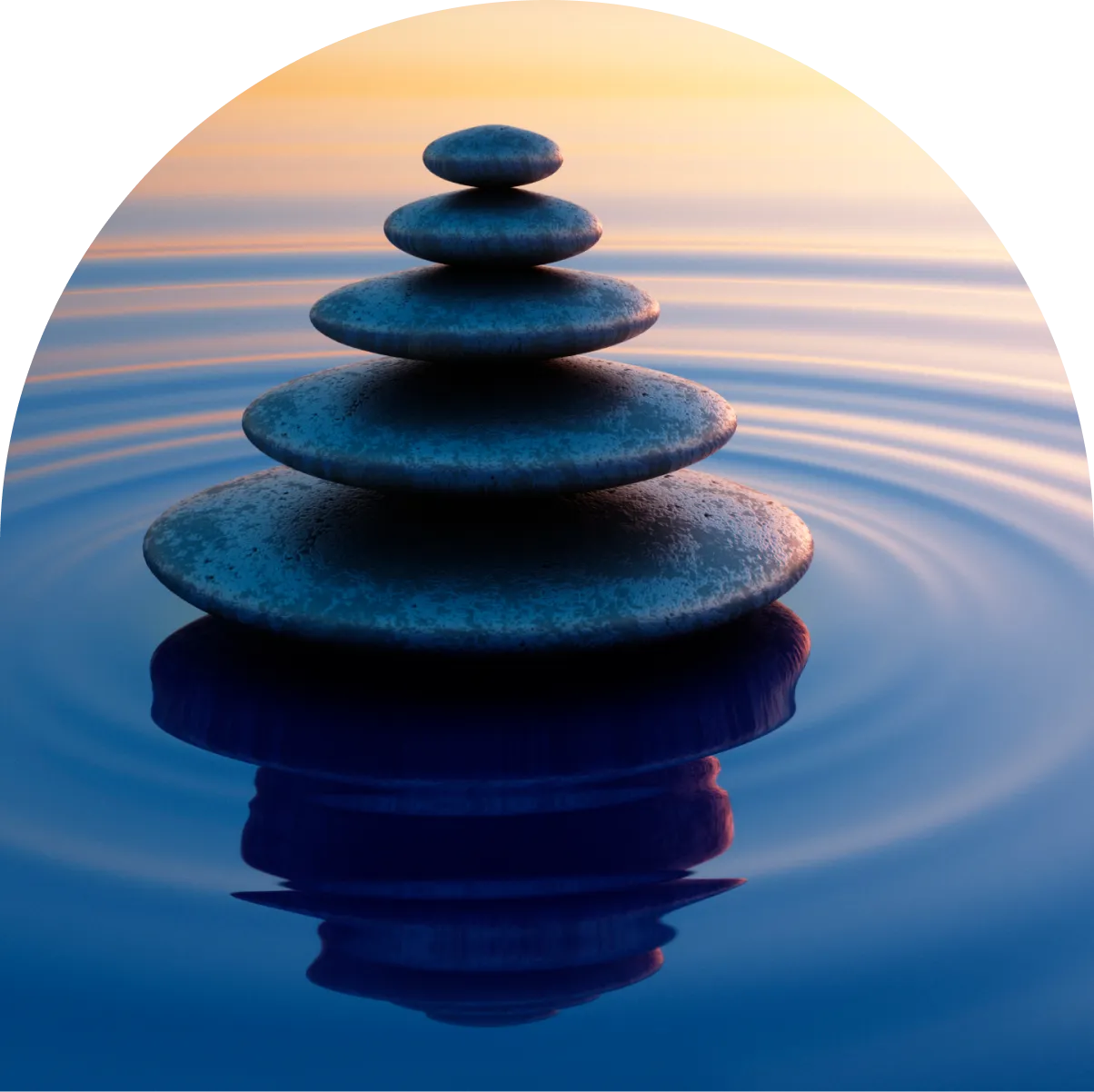 A stack of five stones in the water.