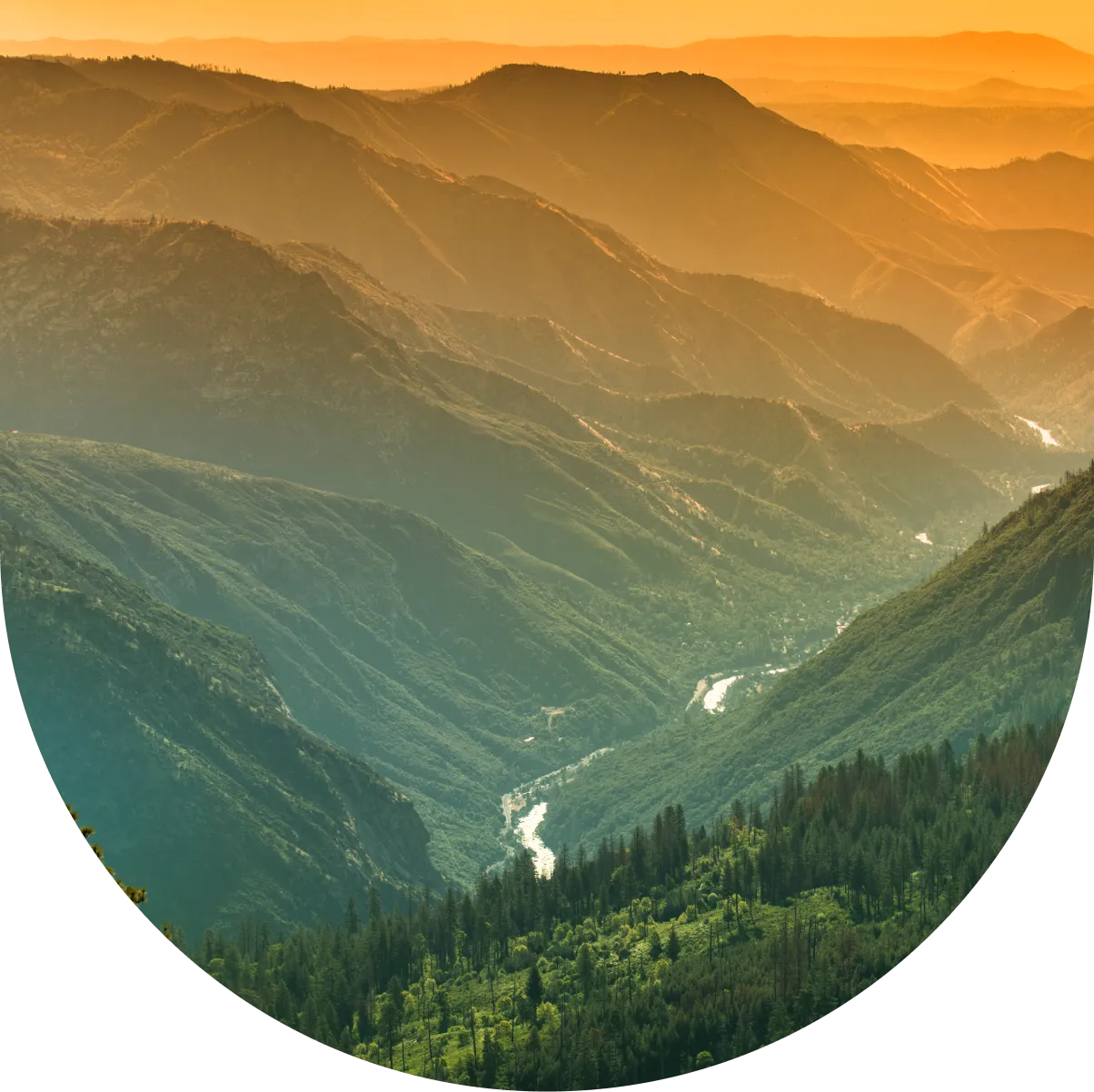 A view of the mountains from above at sunset.