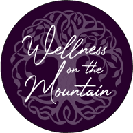 A purple circle with the words wellness on it.