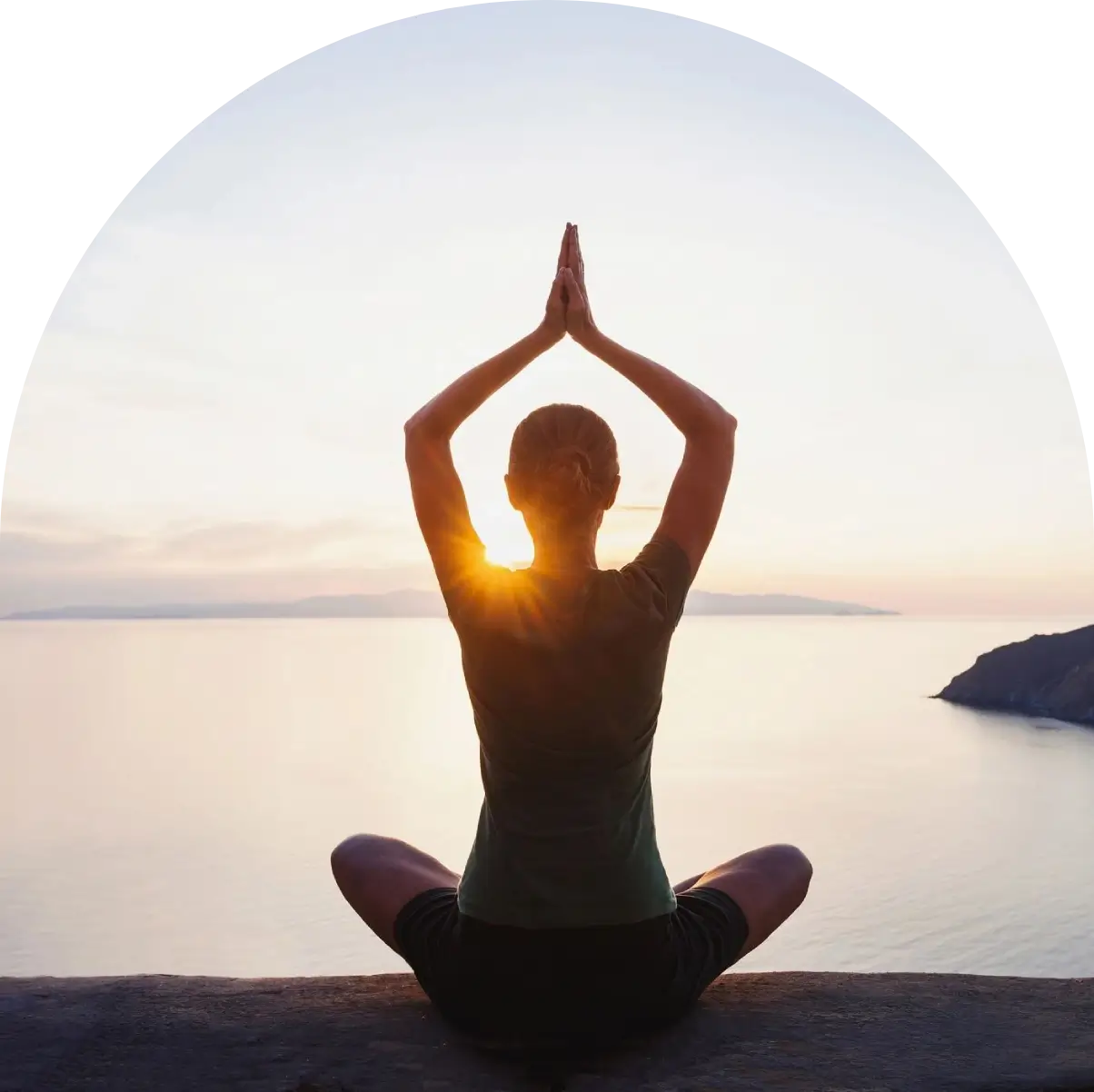 A person sitting in the air doing yoga