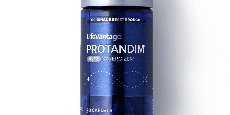 Protandim supplement bottle against dark background.
