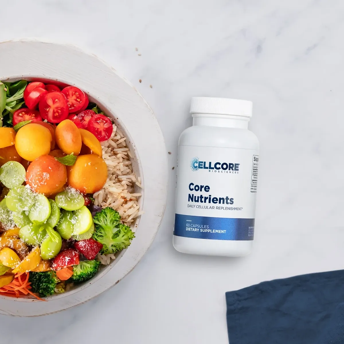 Salad bowl with nutritional supplement bottle.