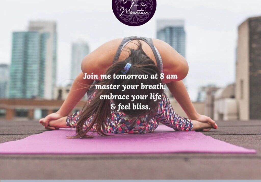 Yoga pose on rooftop with city backdrop.